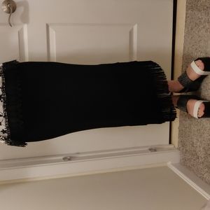 Jersey black asymmetrical skirt with fringe trim. Excellent condition.